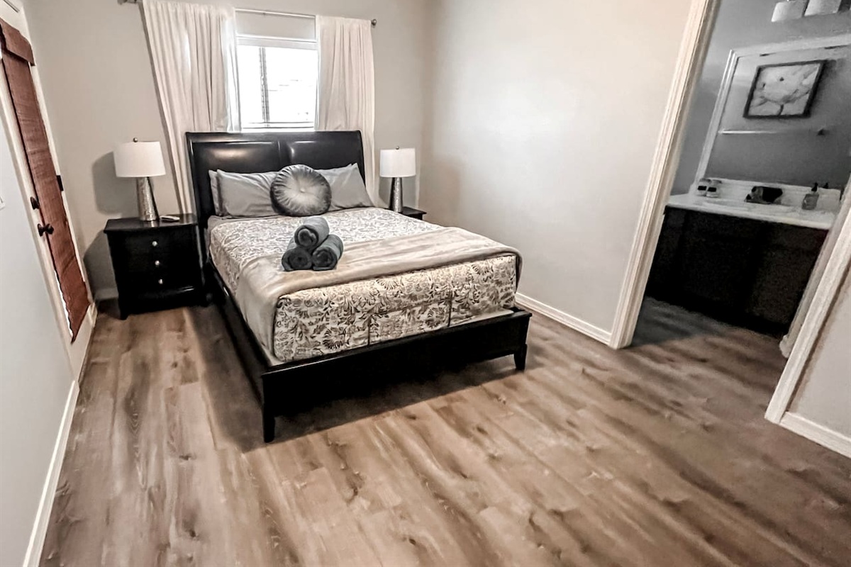 Bedroom #3 with comfortable queen bed and private bathroom