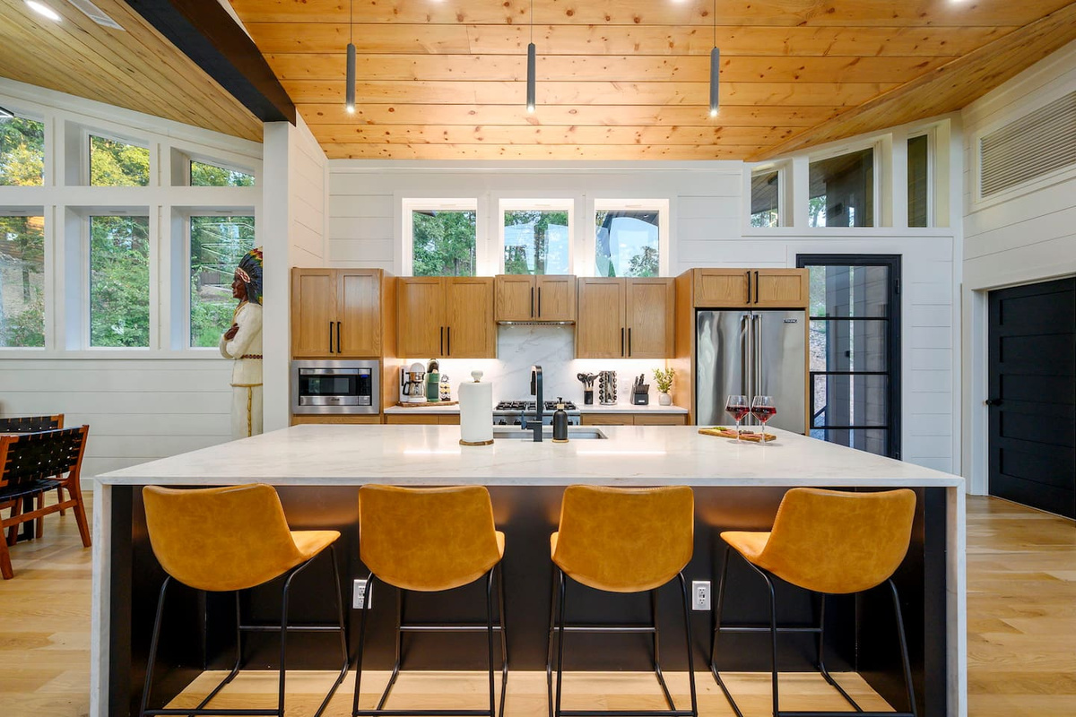  A beautiful kitchen made for entertaining, with upscale finishes and a warm, inviting cabin feel.