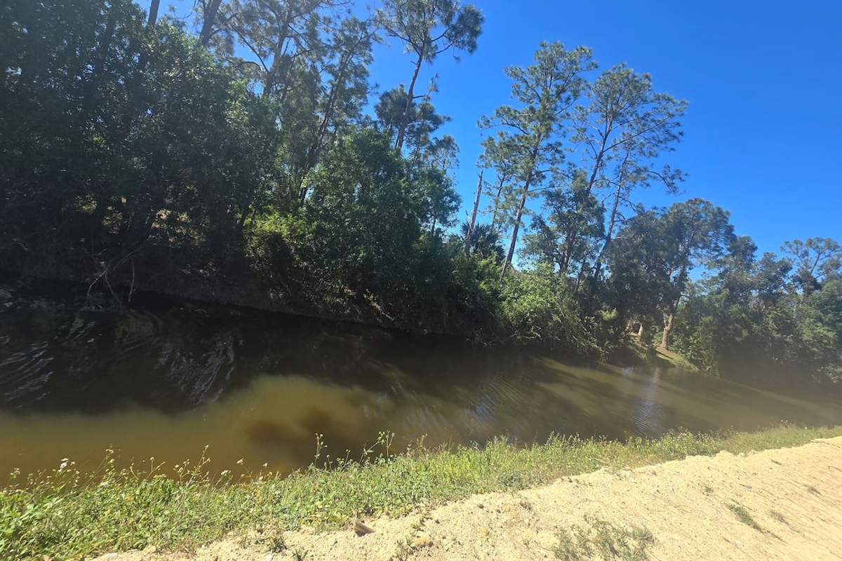 Canal views just beyond the fenced backyard — your peaceful Florida escape.
