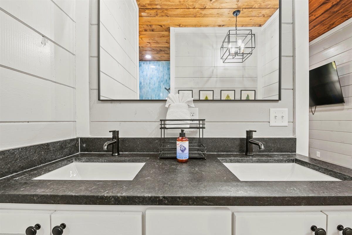 Refresh and rejuvenate in a bathroom space that marries sleek modernity with rustic charm, perfect for pampering.