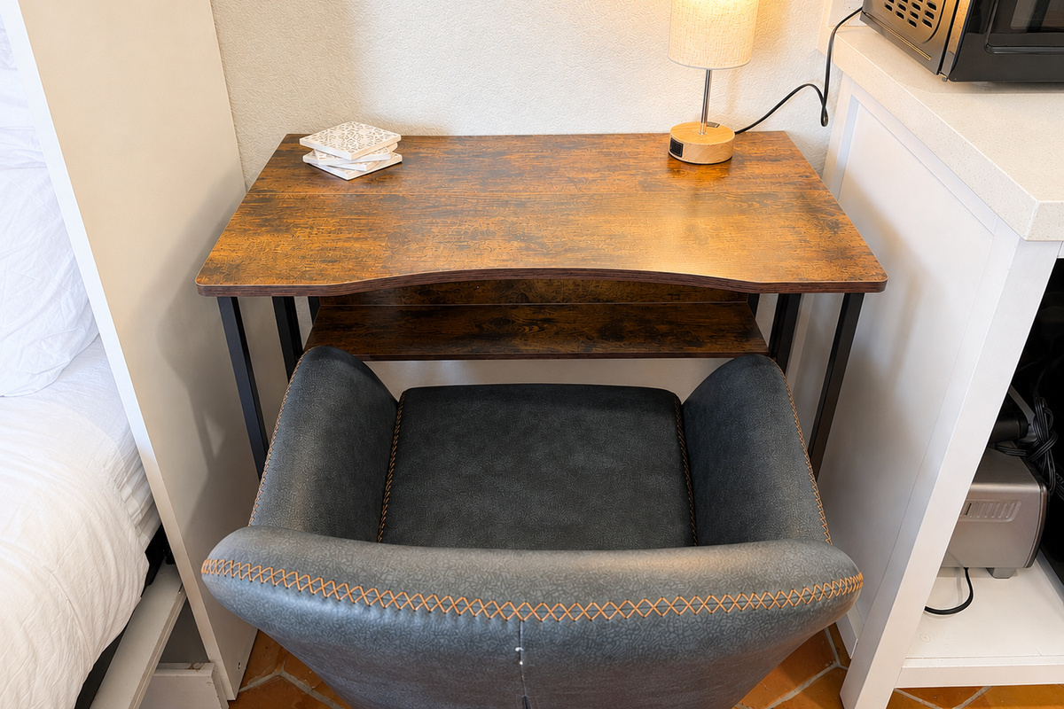 Get some focused work done at this laptop friendly workstation complete with a touch activated lamp that has an outlet for charging devices at night or powering your laptop during the day.