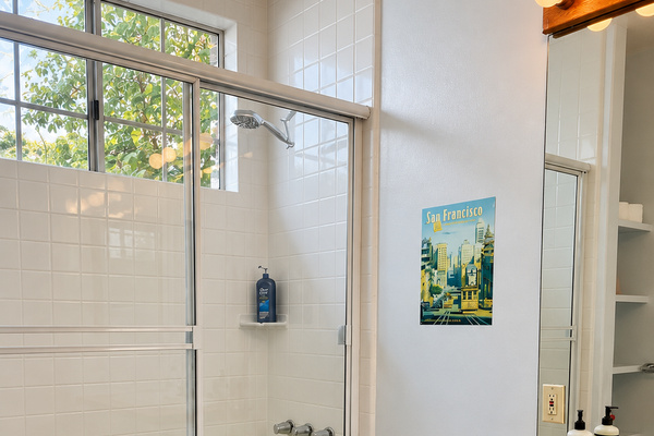 Bathroom with bathtub and shower.