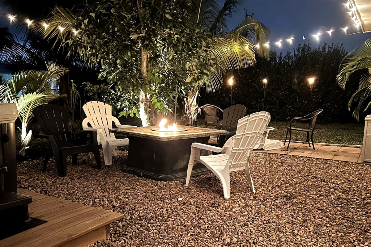 Gas Fire Pit for gathering with friends and family, offering plenty of seating and a grill for cooking out