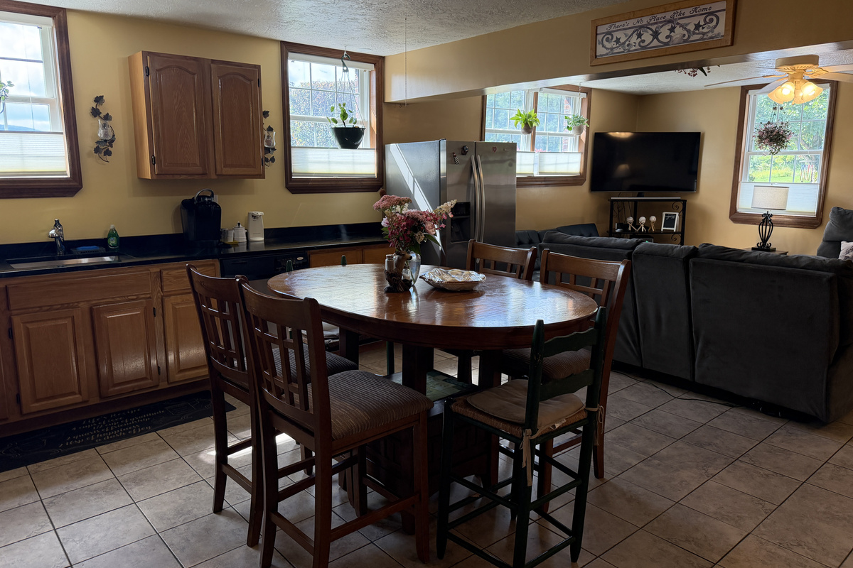 Open concept kitchen, dining and living areas.