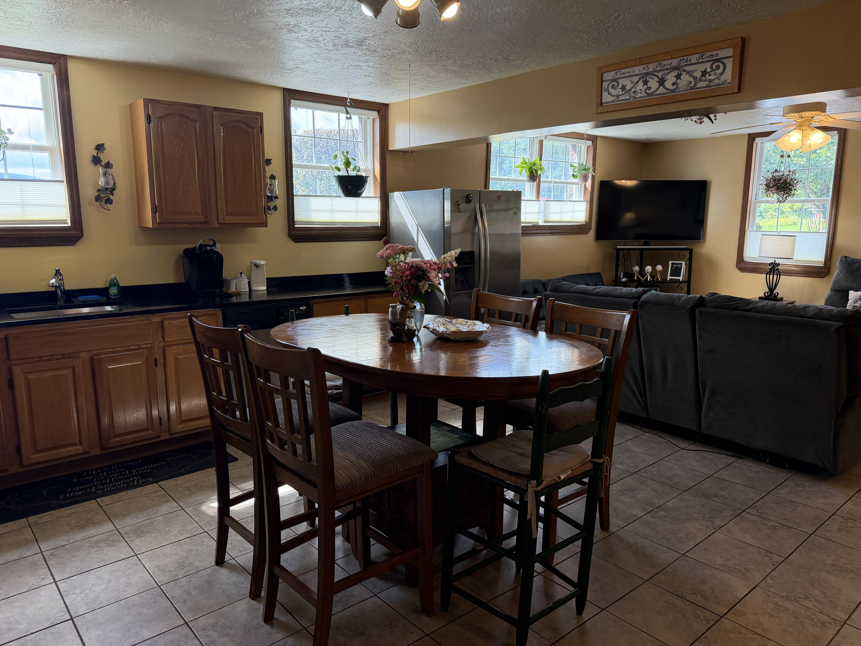 Open concept kitchen, dining and living areas.