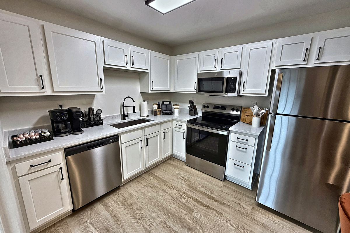 Full kitchen with stainless appliances, dishwasher and everything you need to cook