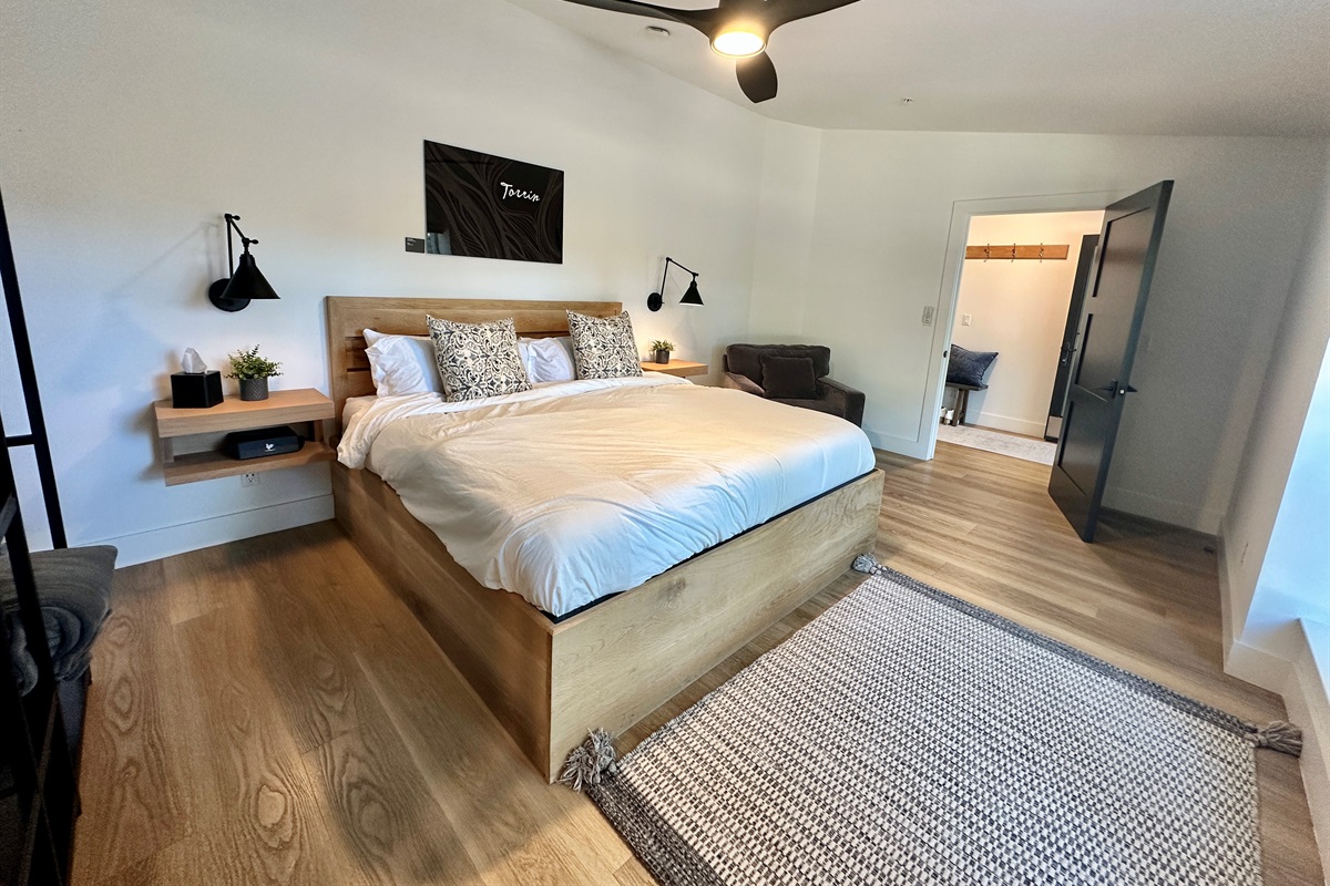 A bright, thoughtfully designed space that offers a smooth transition between the sleeping area and a private dressing nook.