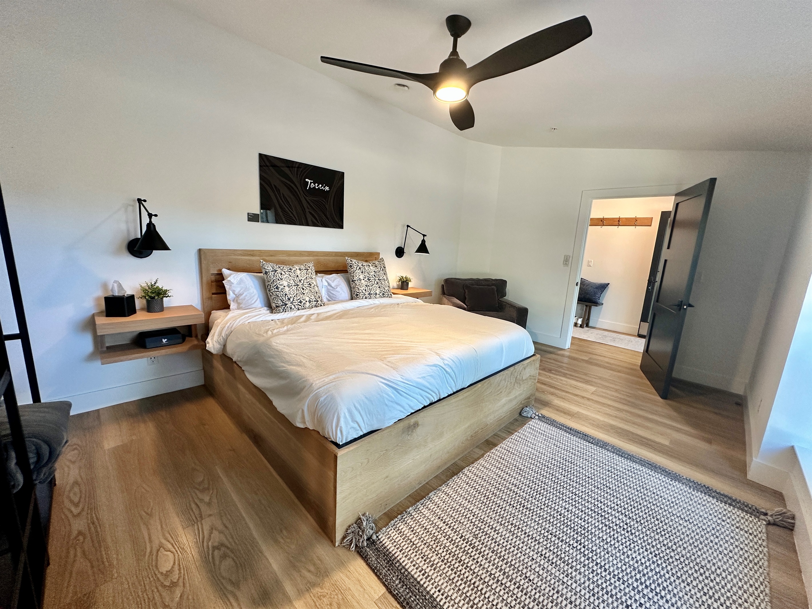 A bright, thoughtfully designed space that offers a smooth transition between the sleeping area and a private dressing nook.