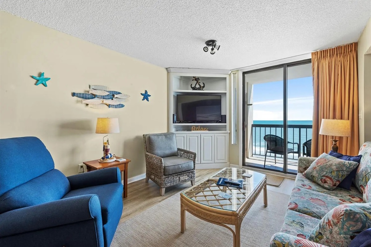 Oceanfront Living room with balcony access