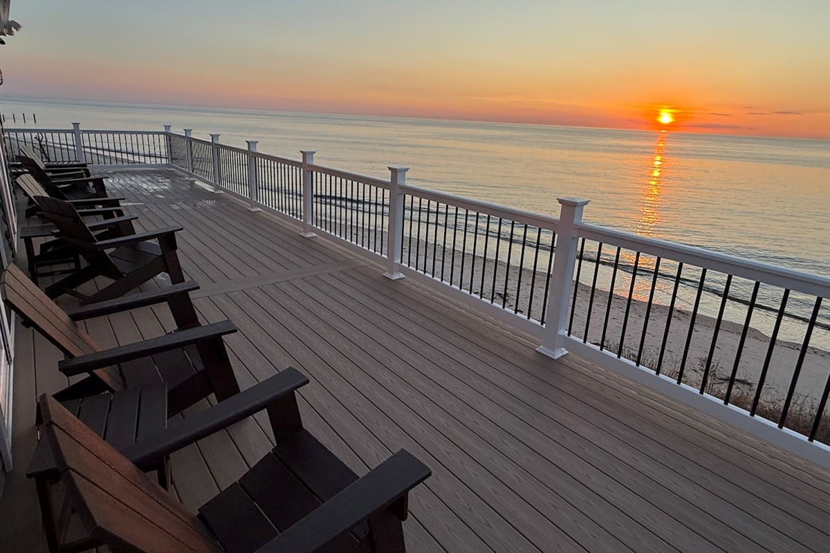 Unwind on the expansive private deck, which provides an ideal setting to enjoy a beautiful sunset over the ocean. The deck is equipped with comfortable lounge chairs, making it a perfect spot for relaxation.