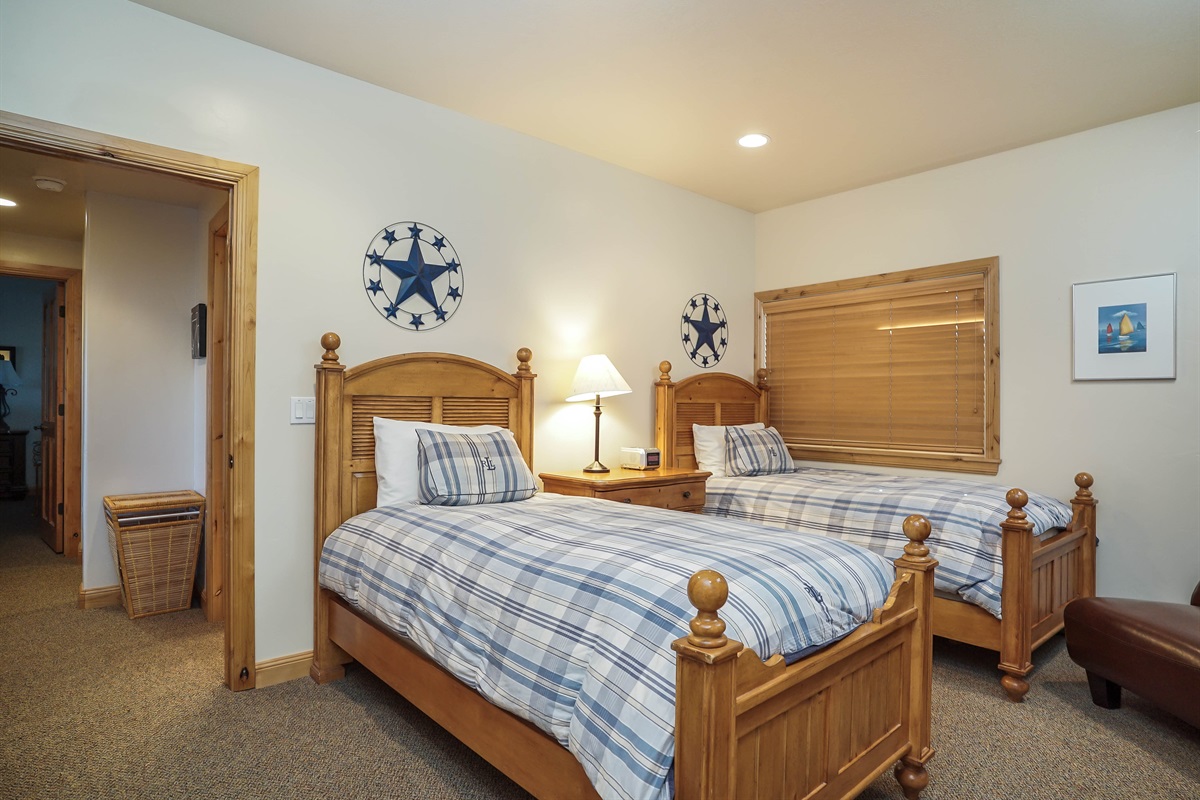 Downstairs bedroom with two beds—ideal for kids or additional guests.