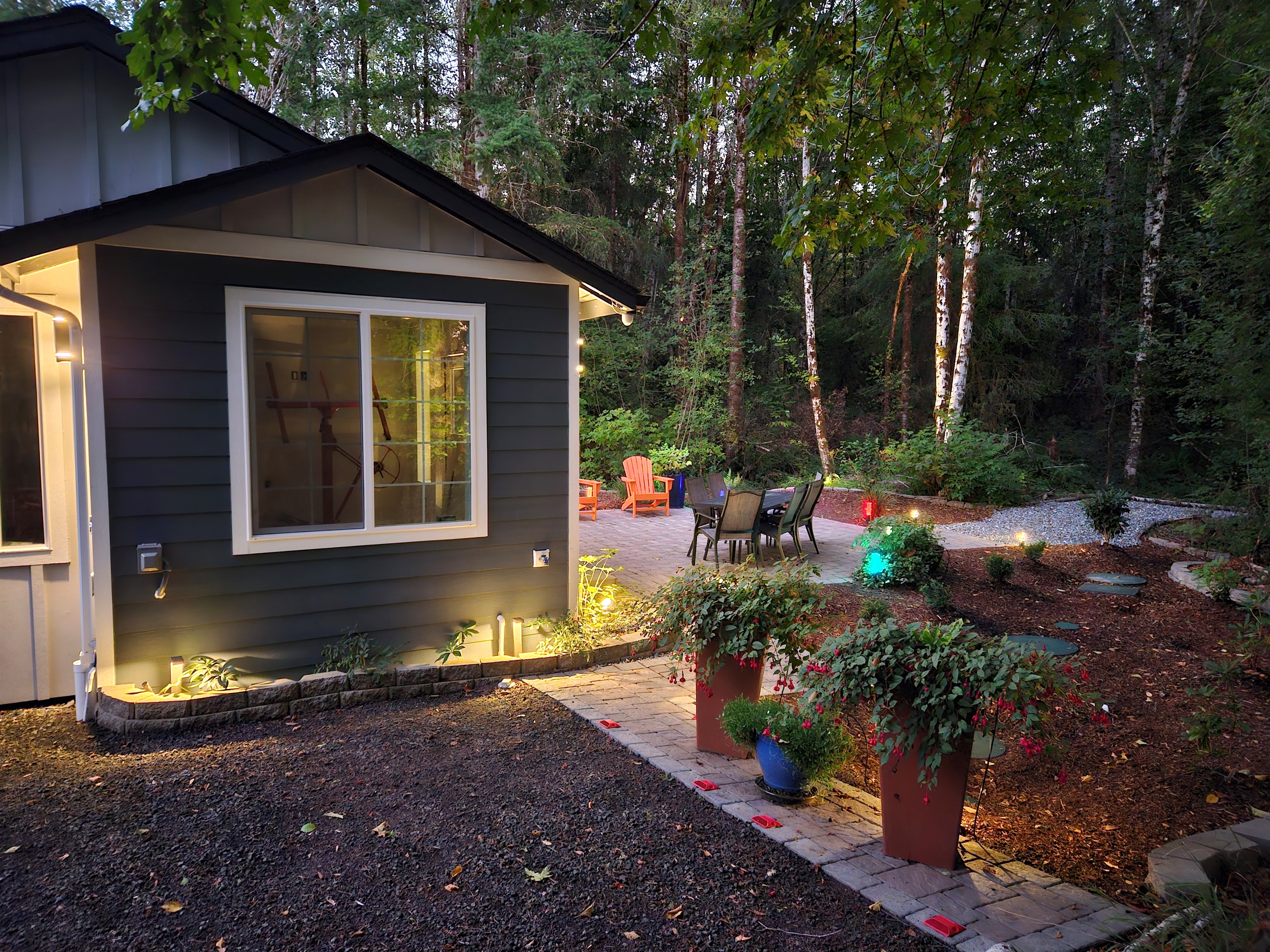 Twilight brings garden magic as the colorful landscape lights illuminate, the daytime critters bed down, and the owls begin to stir.