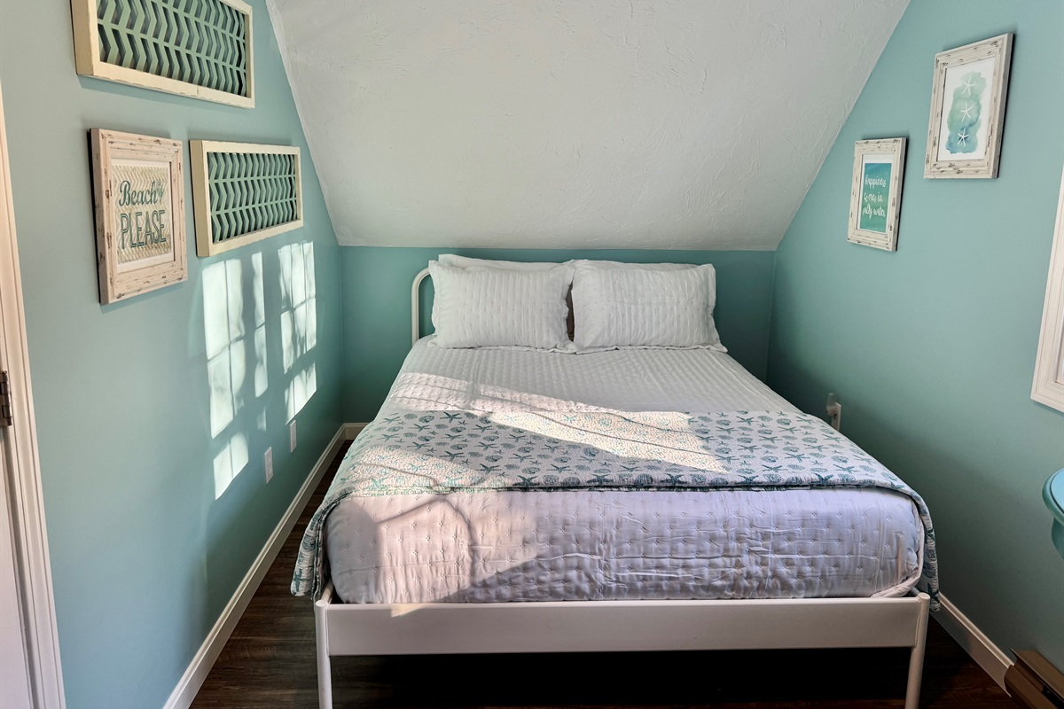 Bedroom # 4 with queen bed and two twins