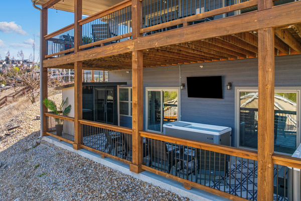 Upper deck for gathering; lower wellness porch for revitalizing.