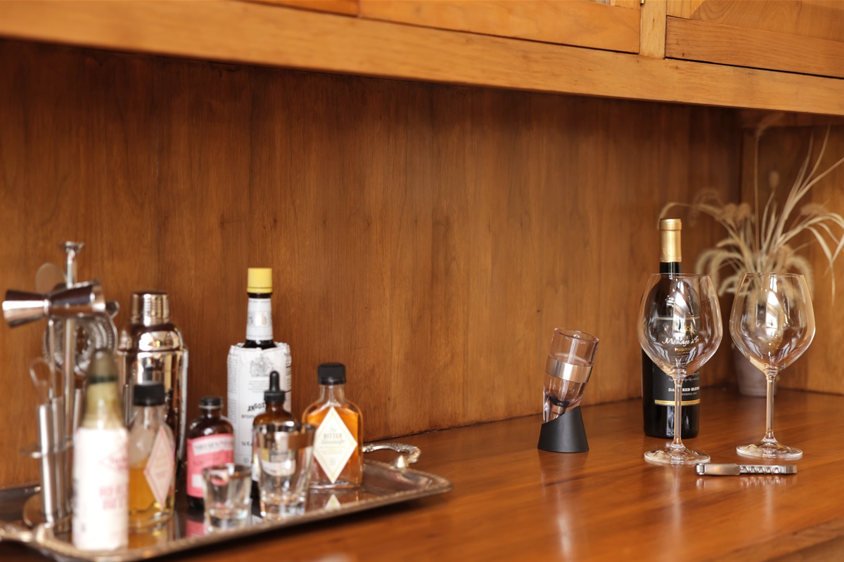 Bar set up along with ice bucket, wine aerator, ane more! White and red stemmed and non-stemmed glassware, and rocks glasses.