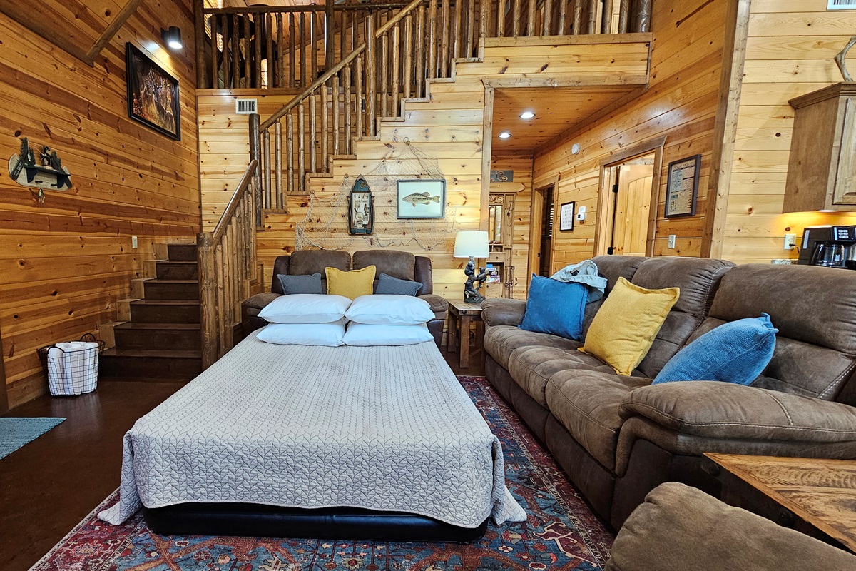 Queen air mattress setup for bedtime for two in the Living Room.
