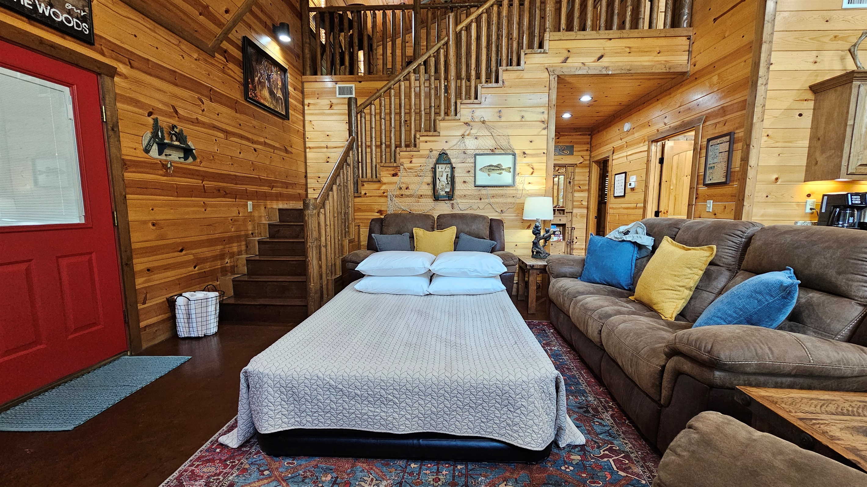 Queen air mattress setup for bedtime for two in the Living Room.