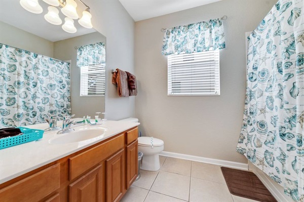Beautiful beach-themed bathroom on the first floor