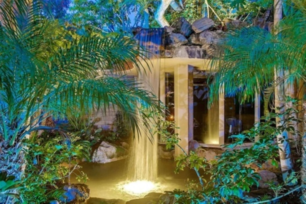 Lagoon waterfall creates the sound of Hawaiian style paradise.