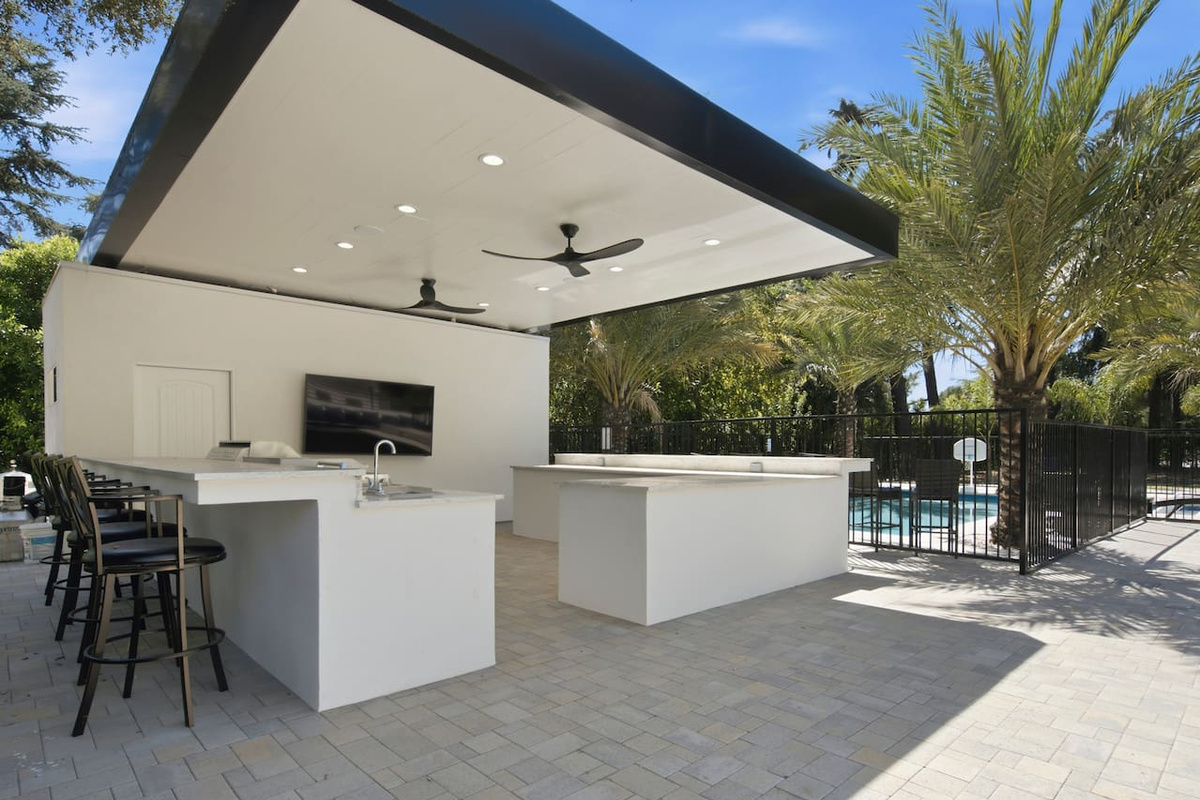 Opens directly into the bright dining space, offering ample seating and peaceful views of the outdoors.