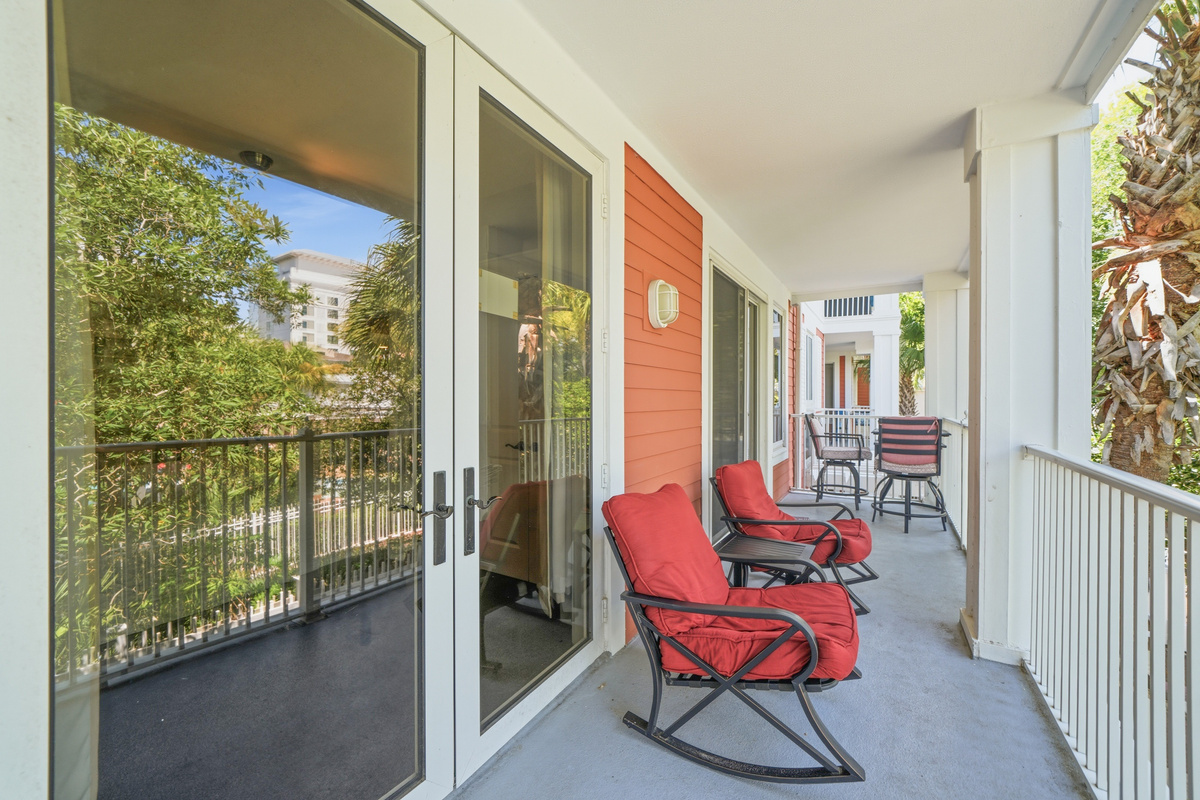 Large 150 sq ft balcony overlooking the pool connects both living & dining room.