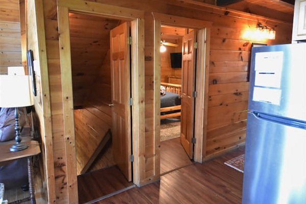 Access to the main floor bedroom and stairs to the lower level from the entry hallway / kitchen area. 