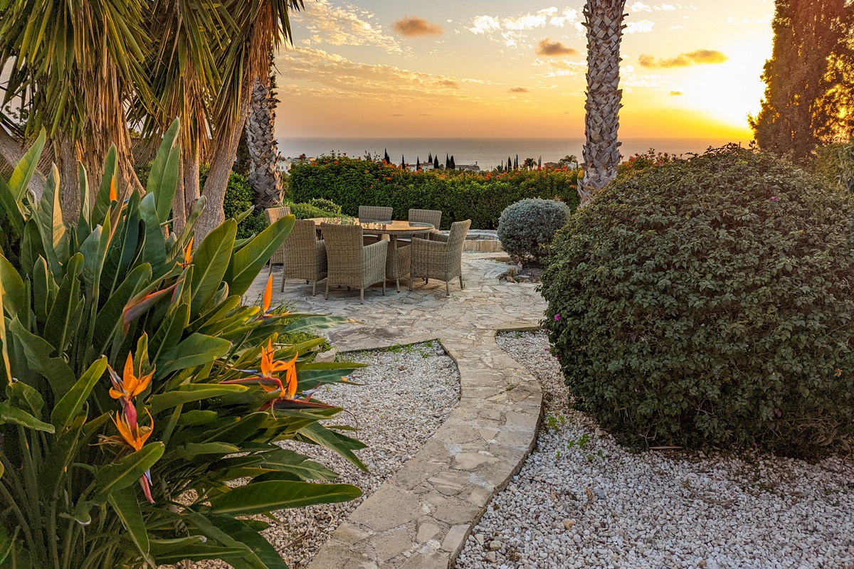 Gather around the second outdoor dining table nestled in the heart of the garden - ideal for breakfast, lunch, or enjoying the sunset.
