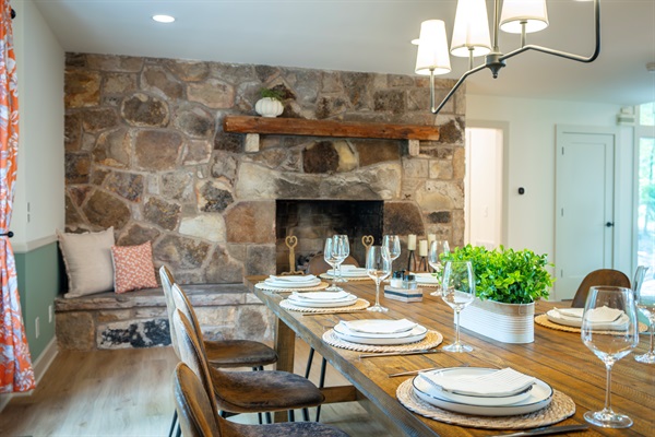 Spacious dining room with gas fireplace - perfect for cozy, seasonal meals with family and friends!