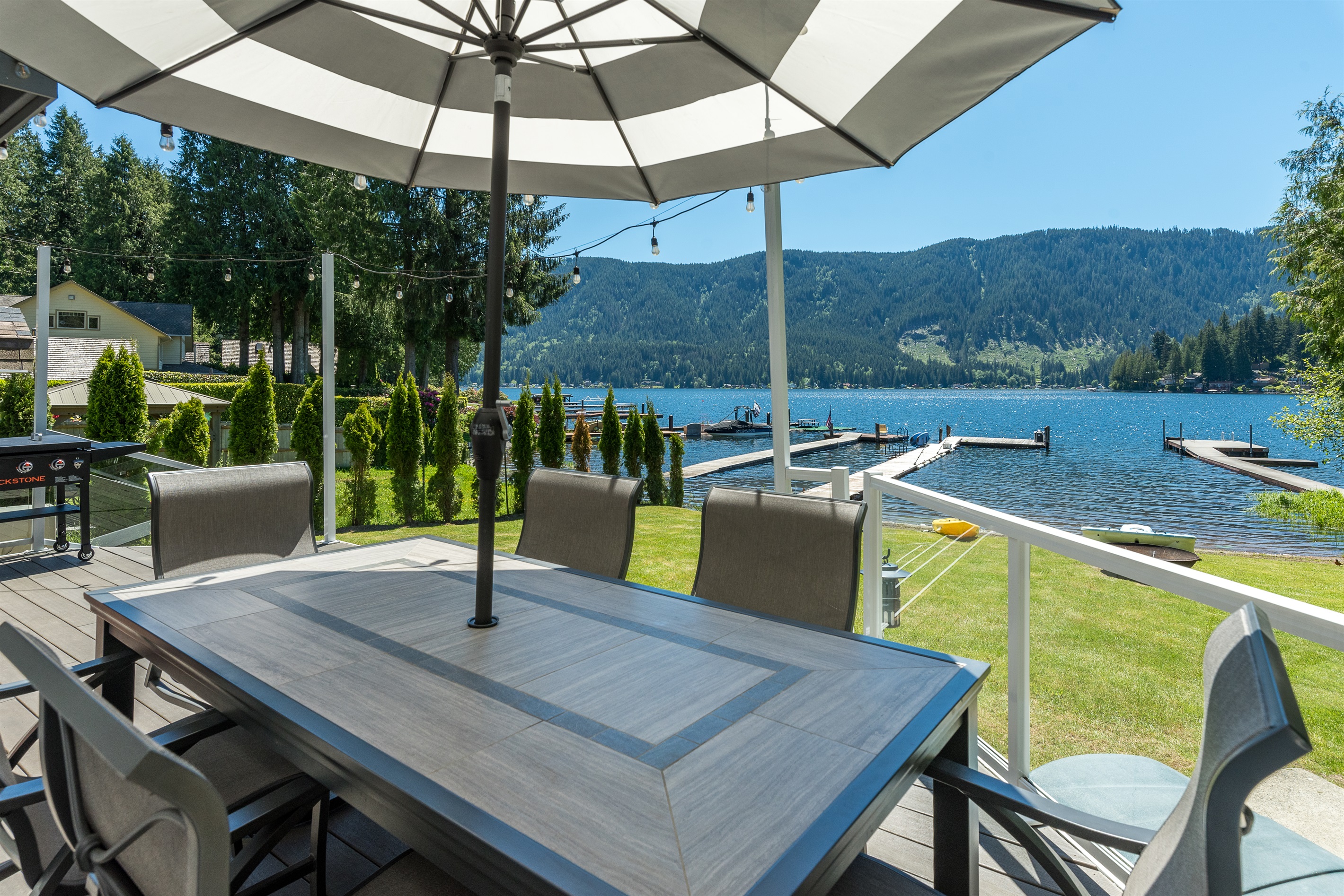 Main level deck with outdoor dining table for 6 and majestic views of the lake.