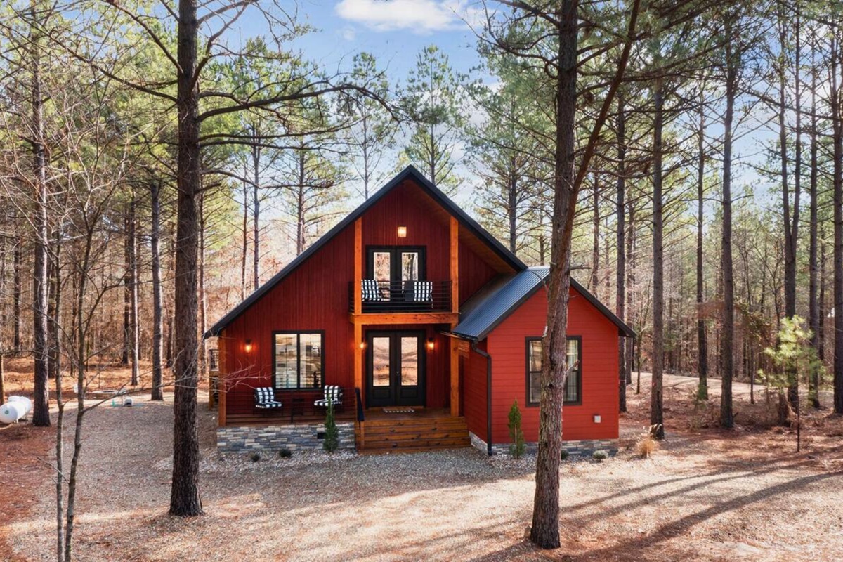 A charming modern cabin tucked into the forest, offering a serene and secluded retreat just minutes from outdoor adventure.