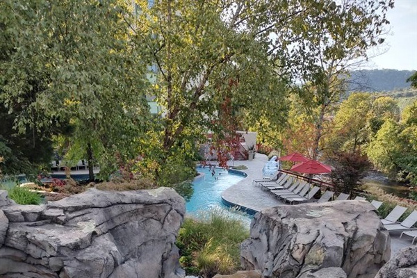 A captivating Fall view of the Lazy River while strolling along the walking trail inside the resort.