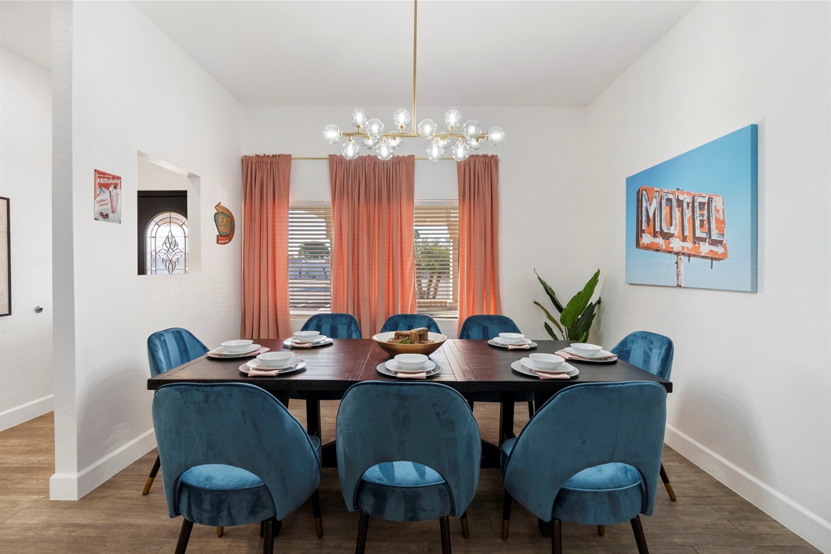 Dining Table seats 8; Small table behind this table seats an additional 4 and bar seats 3!  The pool table room seats another 4 at a high top and 4 at another bar behind the couch!  23 people can comfortably eat a meal between two adjoining rooms!