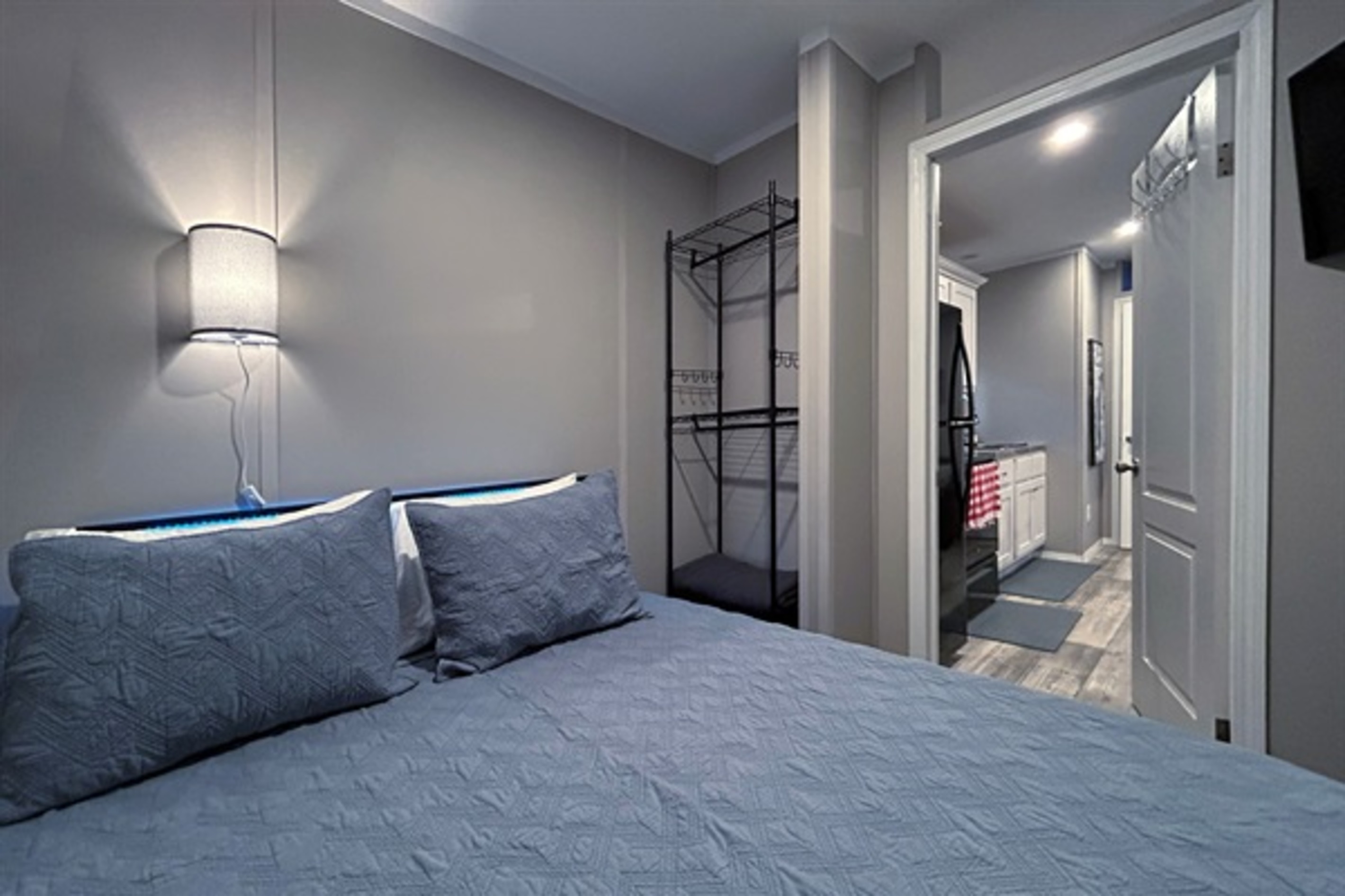 Bedroom #2 with queen bed, smart TV and en suite bathroom