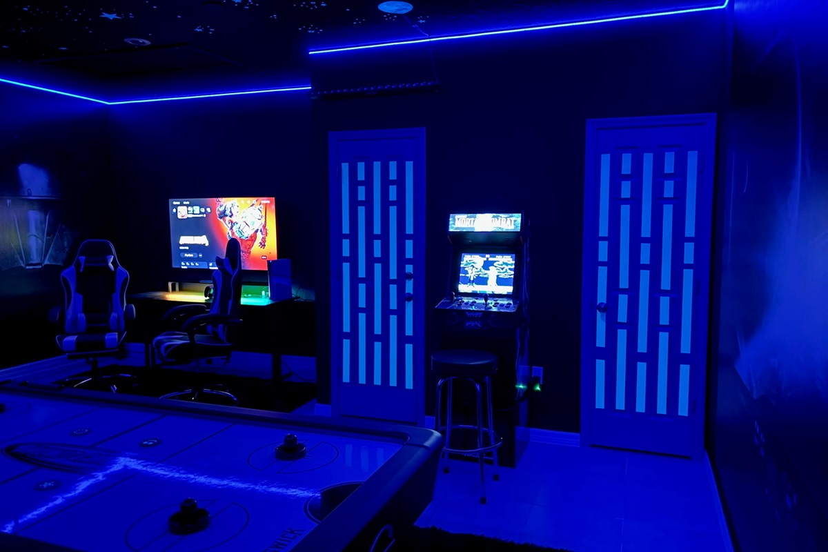 Dual gaming setup with consoles and LED lighting — great for teens and game lovers.