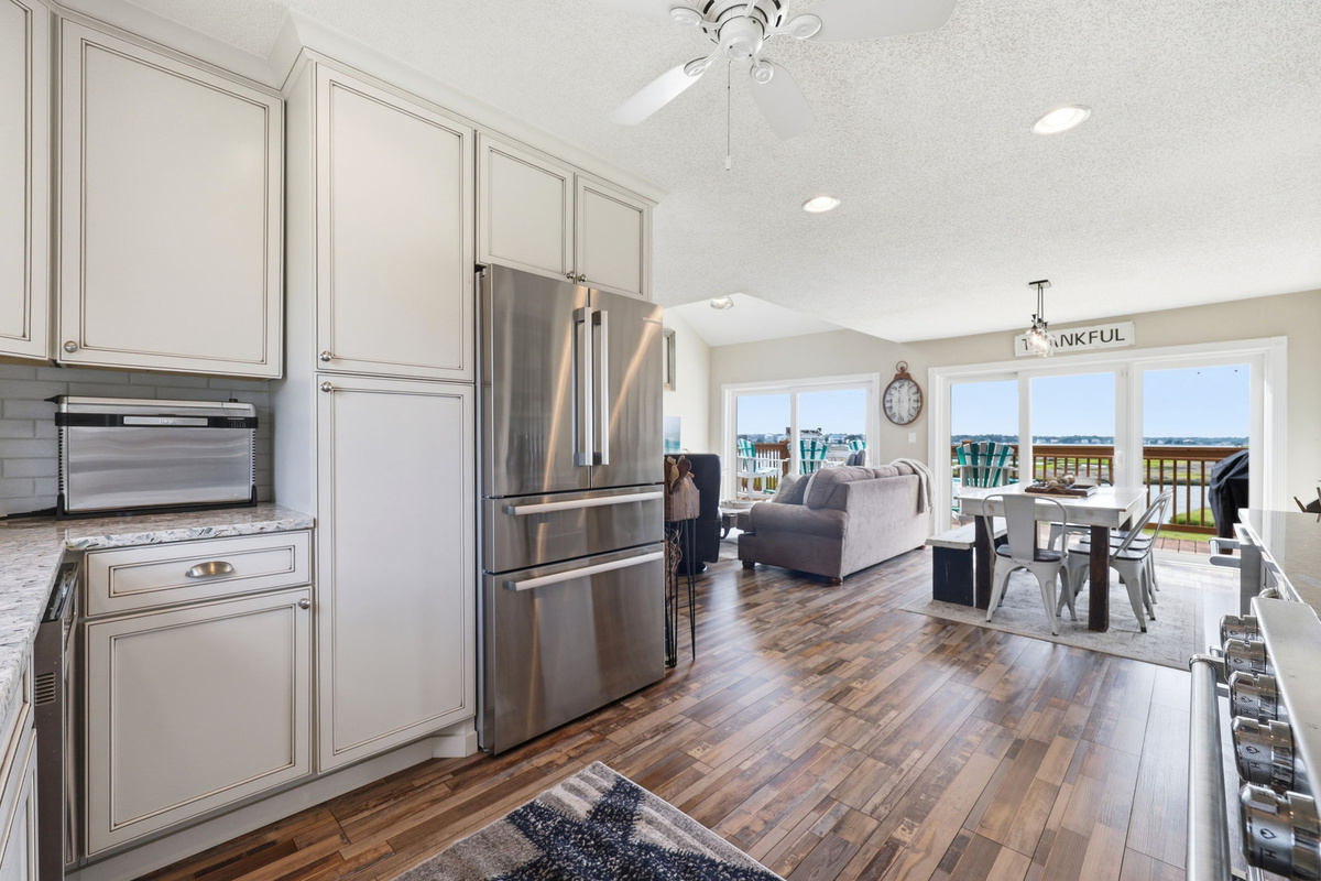 Timeless farmhouse details meet breezy coastal style throughout the home. Check out these beautiful floors, updated appliances & coastal views!