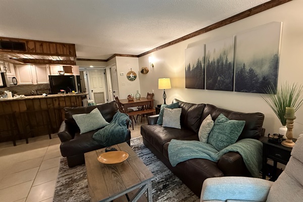 The comfortable living room will make you feel right at home as you ease back into the oversize couch or chair and snuggle up with one of the soft throws.  Get comfortable and turn on your favorite streaming site.