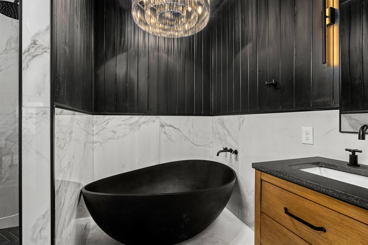 Luxurious Bathroom: Indulge in the freestanding tub and modern decor for a spa-like escape!