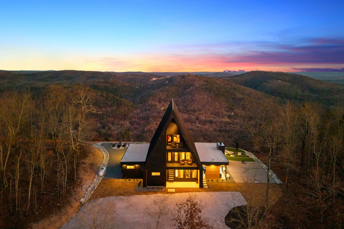 With the home lit up against the landscape, this view feels extra magical, making evenings here feel peaceful, cozy, and completely unforgettable.