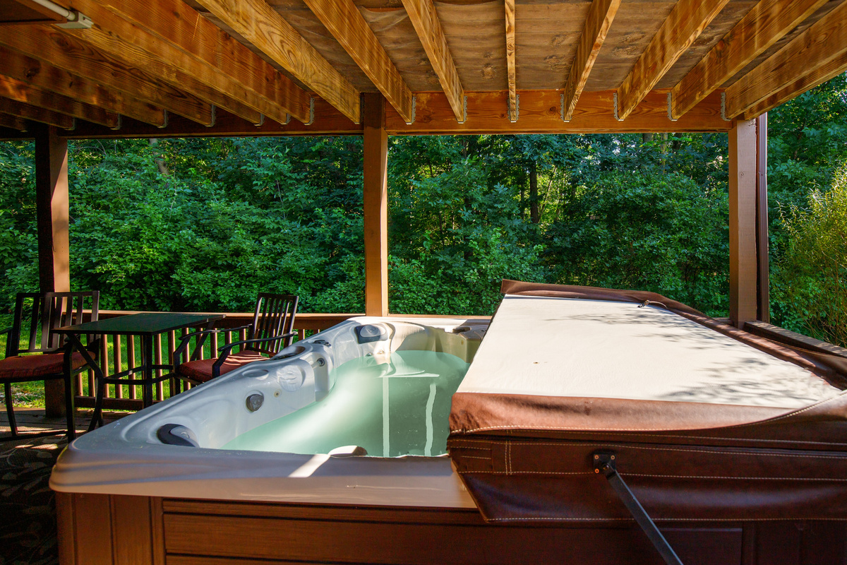Covered hot tub - available year round - cleaned and treated before each reservation