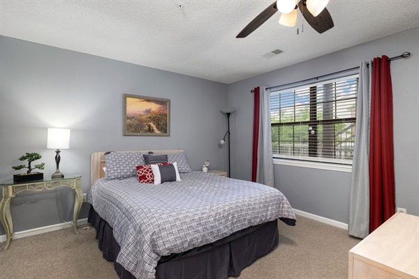 Charming Bedroom: Serenity awaits with inviting decor and natural light for restful nights!