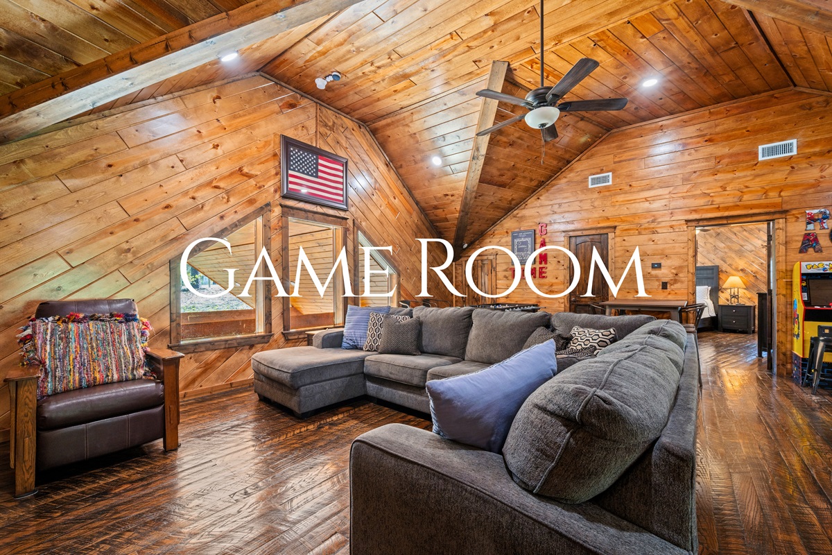 The game room is designed for fun, featuring comfortable seating and a variety of entertainment options that make it easy for guests of all ages to gather and enjoy.