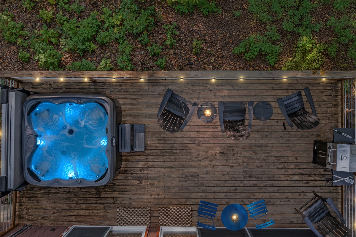 Soak away the day in the hot tub under twilight skies, surrounded by peaceful forest views.