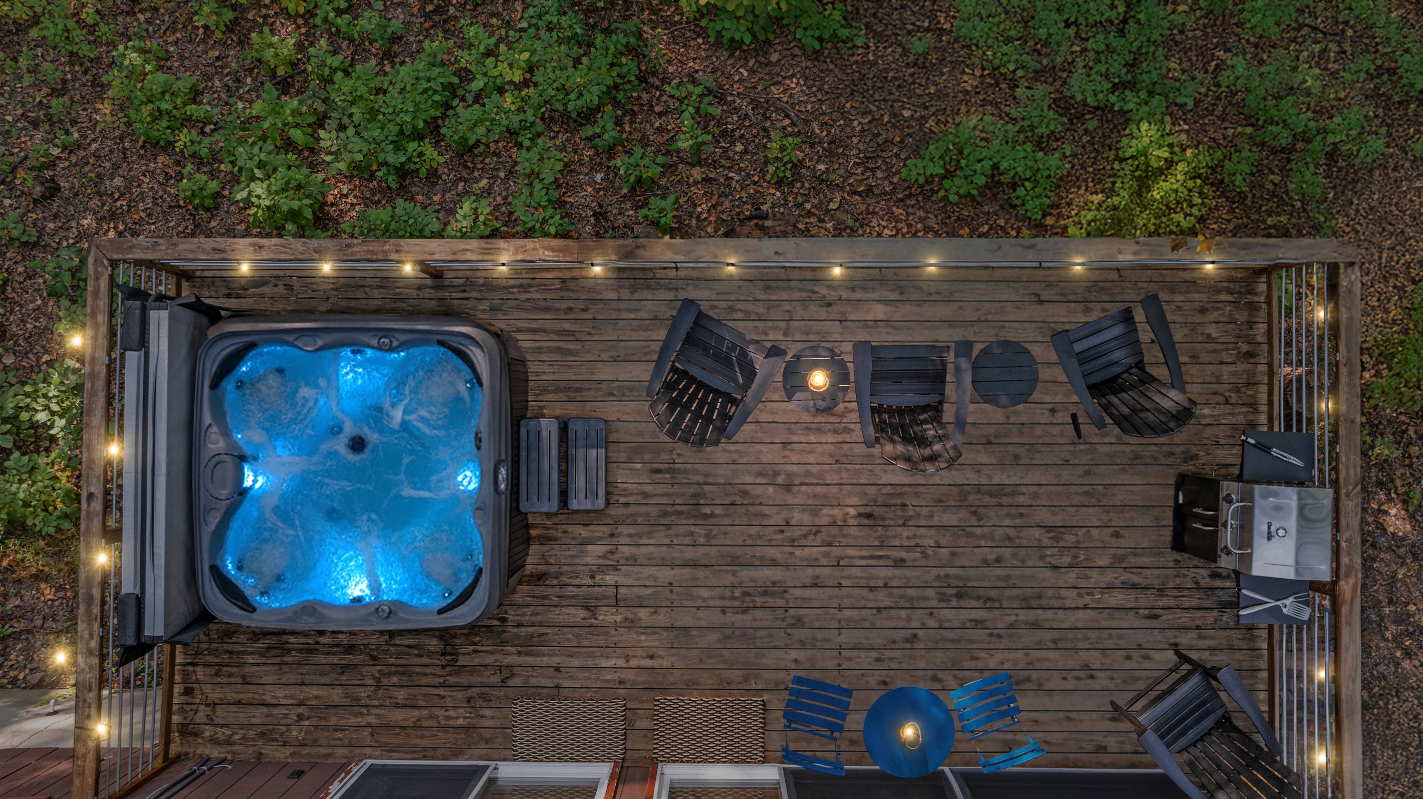 Soak away the day in the hot tub under twilight skies, surrounded by peaceful forest views.