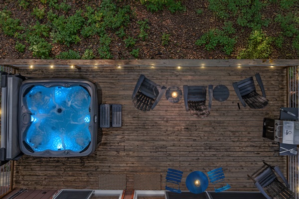 Soak away the day in the hot tub under twilight skies, surrounded by peaceful forest views.