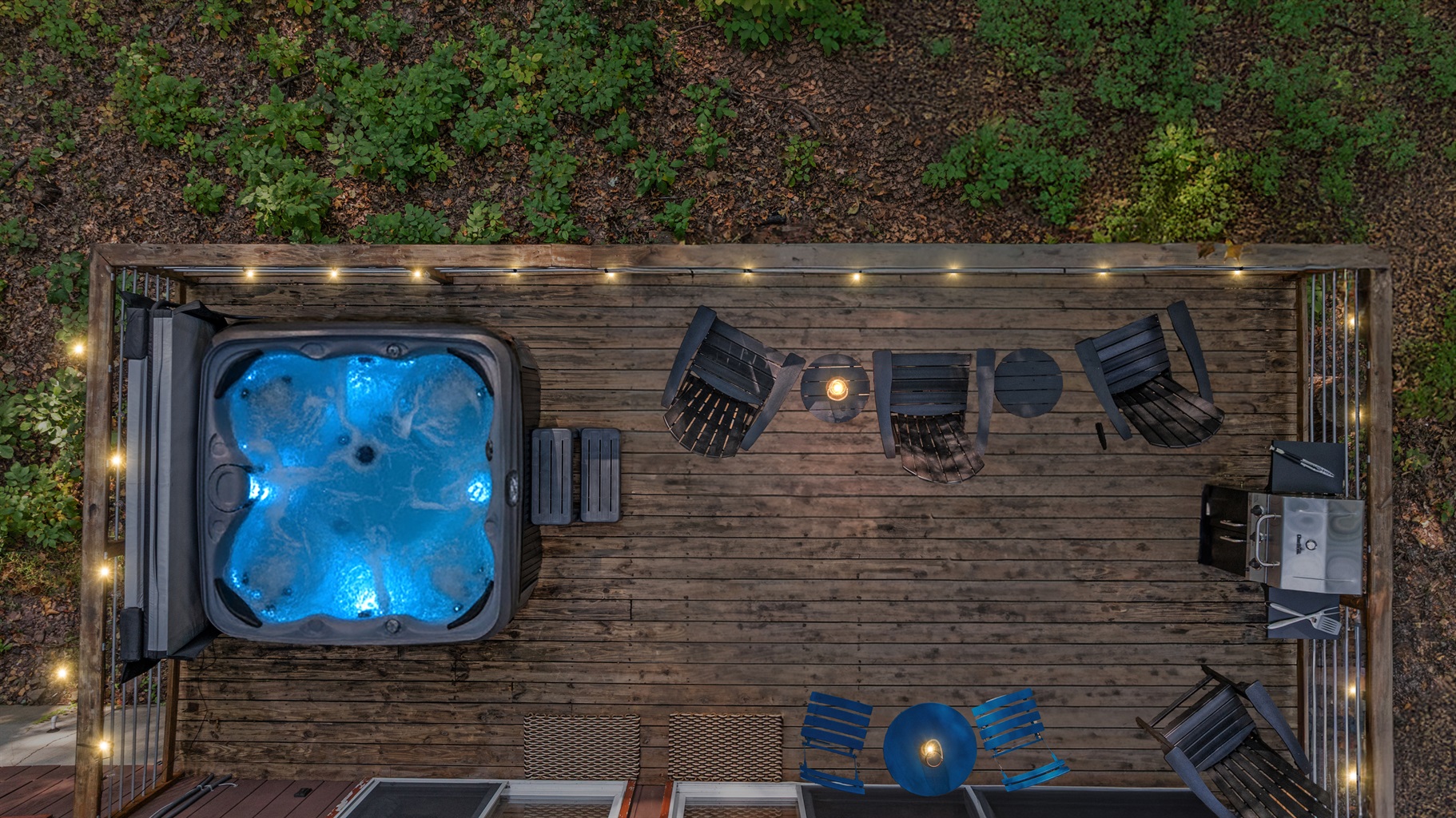 Soak away the day in the hot tub under twilight skies, surrounded by peaceful forest views.