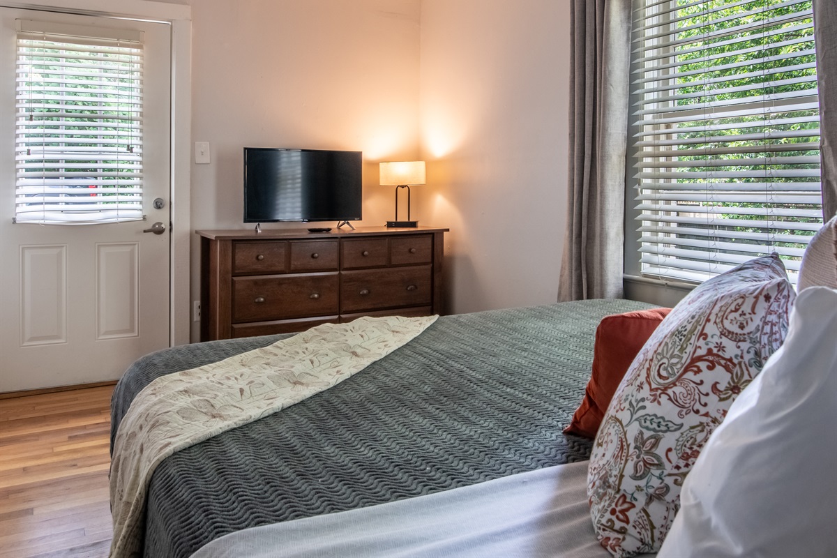 Enjoy your favorite shows in this comfy bedroom with TV and dresser storage.