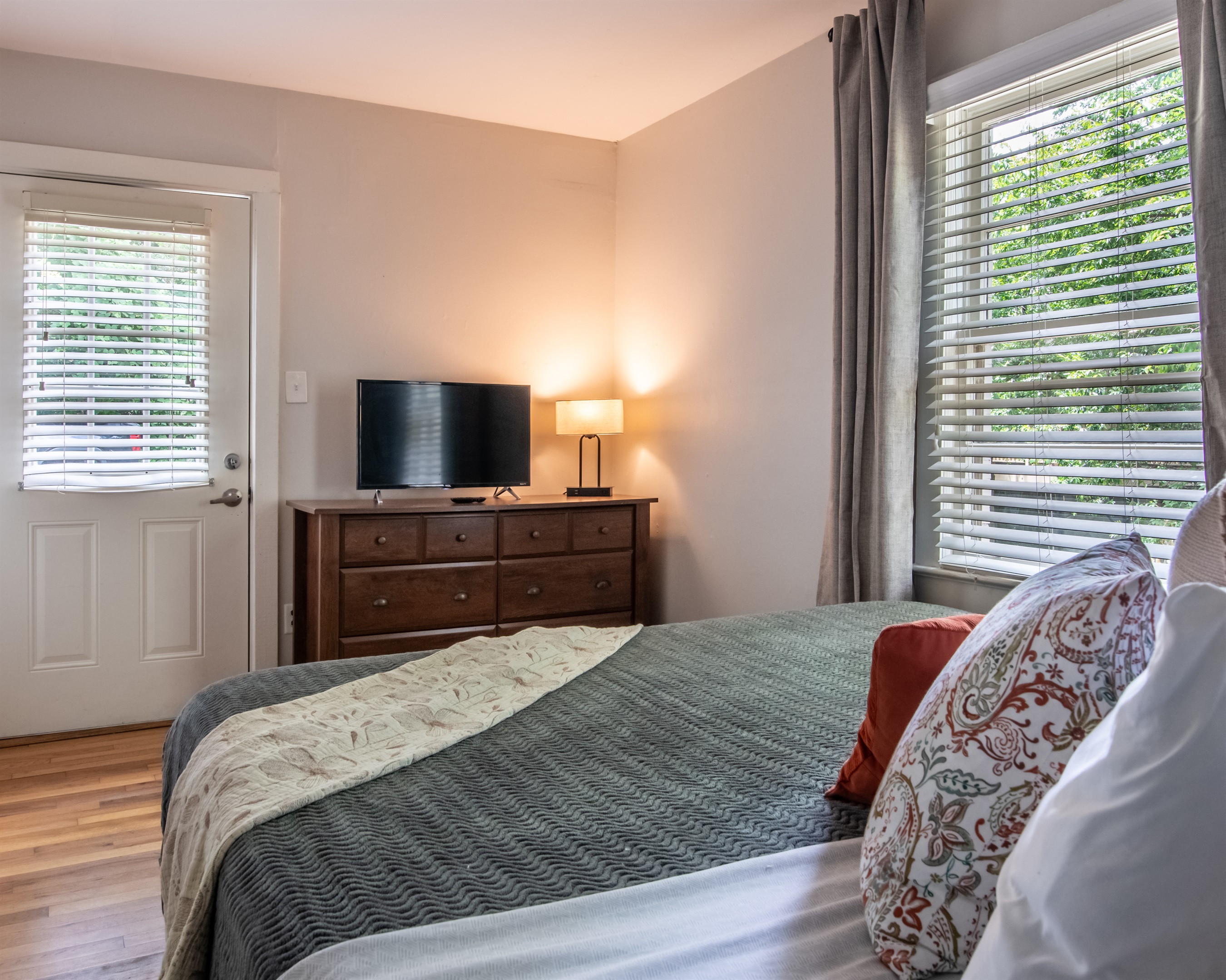 Enjoy your favorite shows in this comfy bedroom with TV and dresser storage.