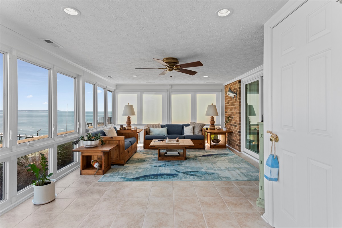 Sunroom Oasis: Enjoy stunning water views from this bright, airy retreat with charming decor!