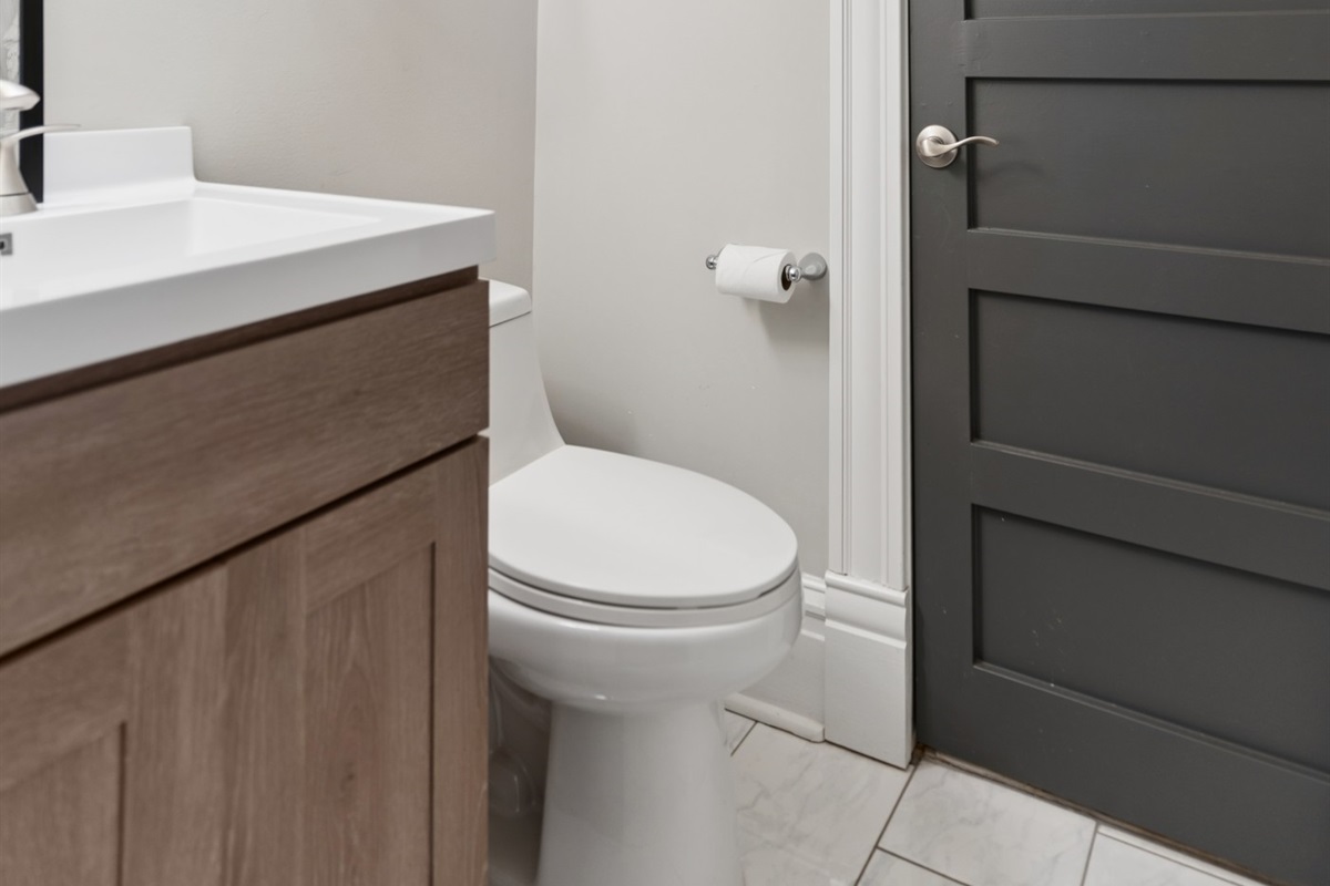 The third-floor full bath is conveniently located just steps from the bedroom.