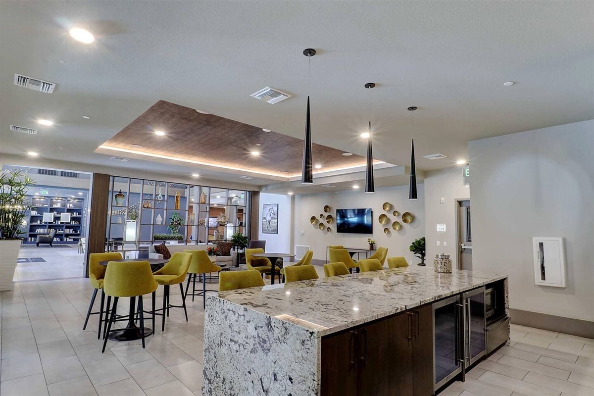 - Enjoy the stylish community lounge with modern seating and cozy ambiance   - Perfect for casual gatherings, remote work, or relaxing with a cup of coffee   - Elegant lighting, bold decor, and open layout enhance your stay experience